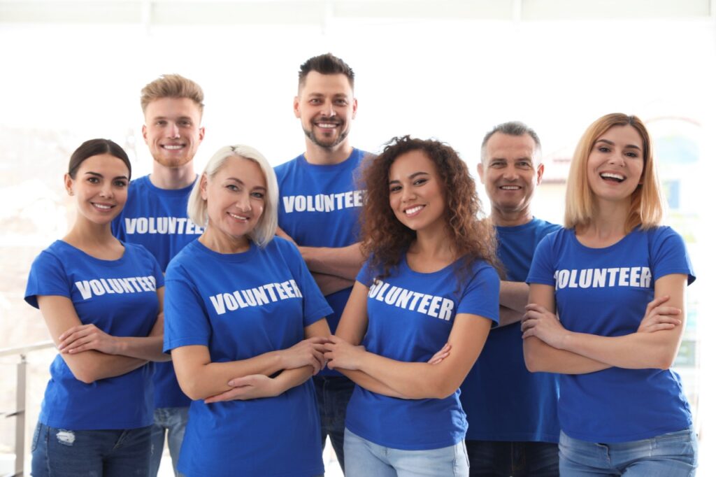 Team of volunteers in blue uniforms