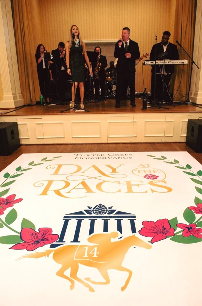 A live band playing jazz or swing can set the mood for day at the races fundraising event.