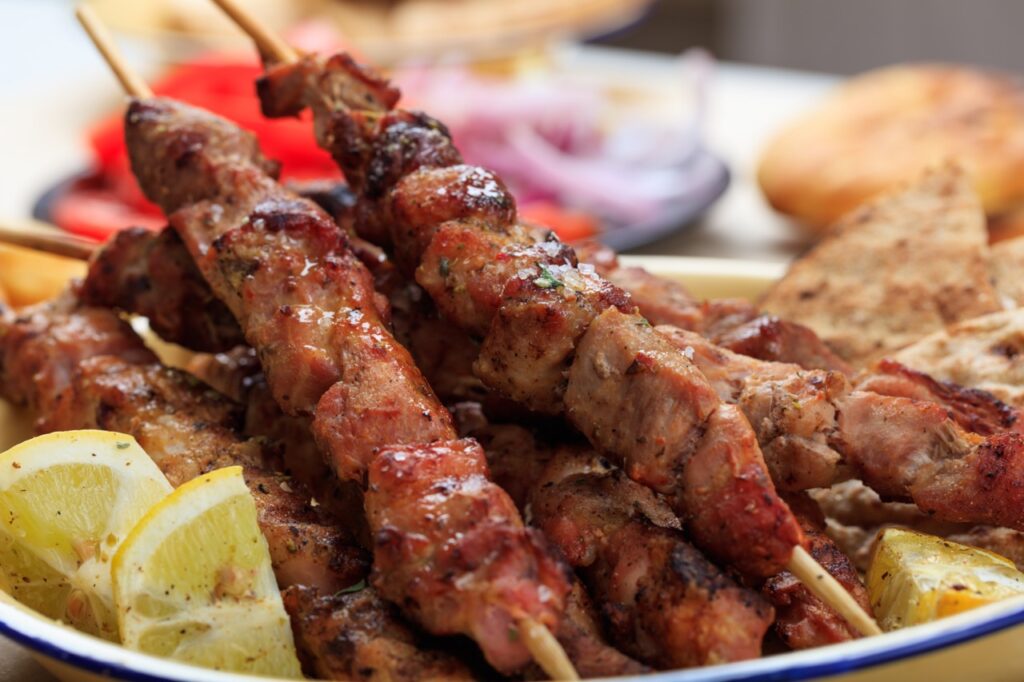 Grilled meat skewers and pita bread