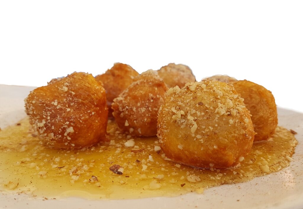 loukoumades donuts with honey and nuts Greek Turkish traditional food sweet