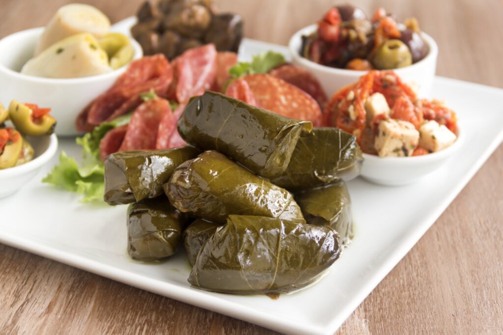 Greek dolmades wrapped with vine leaves feature in a mezze platter.