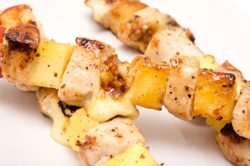 Hawaiian BBQ skewers of marinated meat, served with grilled pineapple for Hawaiian Theme Fundraiser
