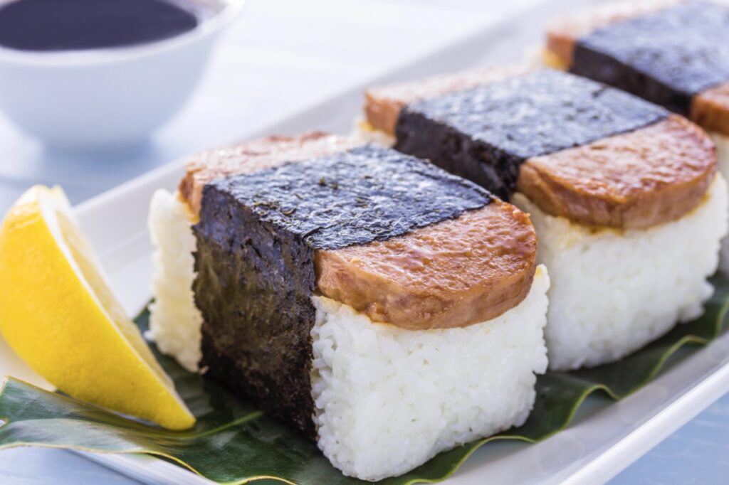 Spam Musubi, which is a popular snack in Hawaii made of a slice of grilled Spam on top of a block of rice, wrapped together with nori (seaweed) for Hawaiian Theme Fundraiser