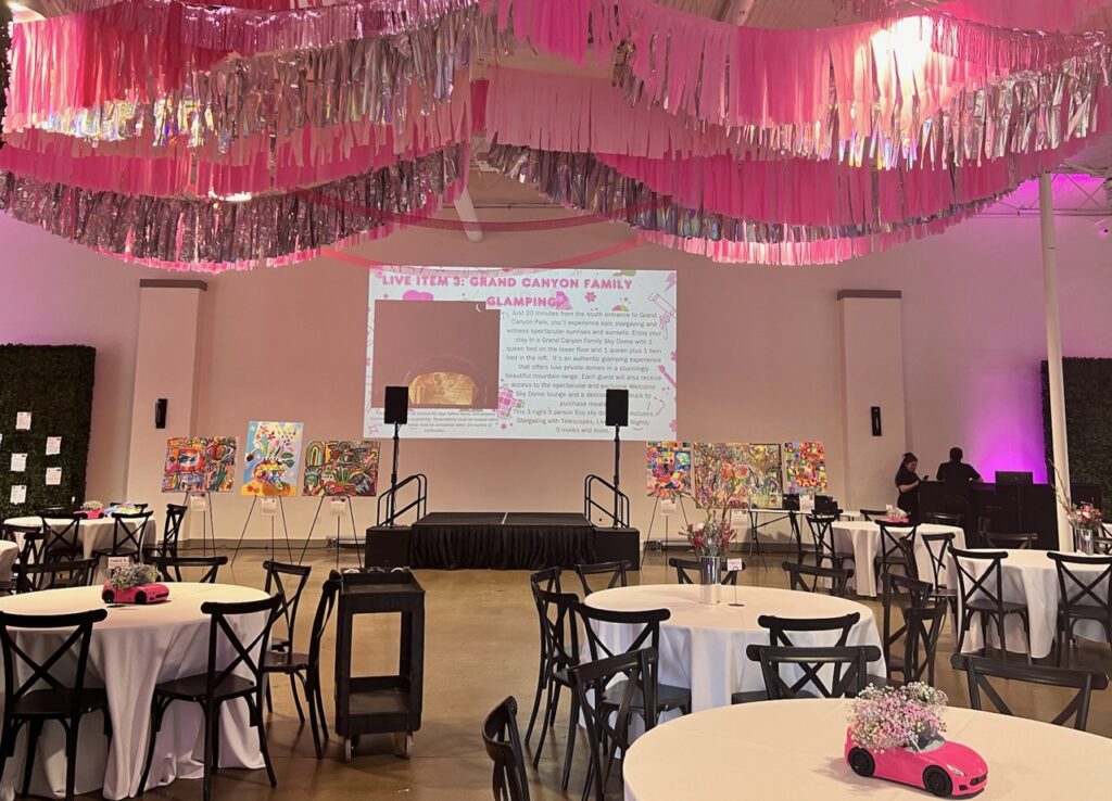 A Barbie-Themed Fundraiser event room decorated in pink.