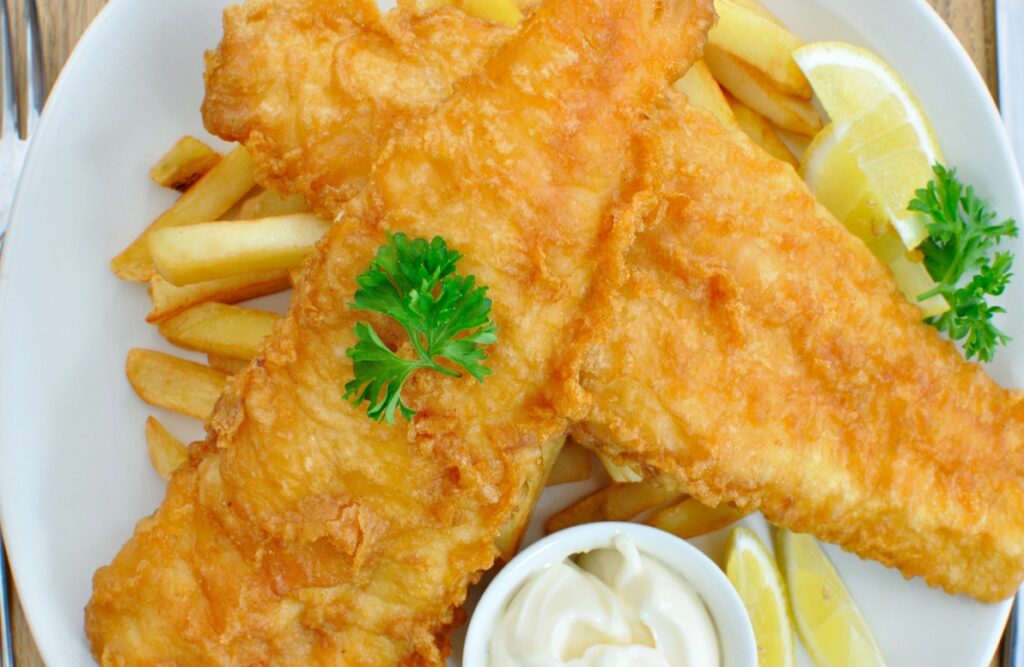 A plate of fried fish and chips.