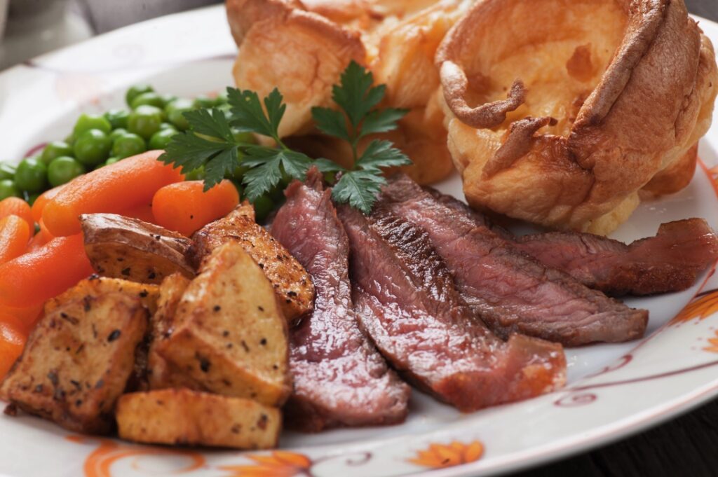 British Sunday Roast With Yorkshire Pudding And Vegetables