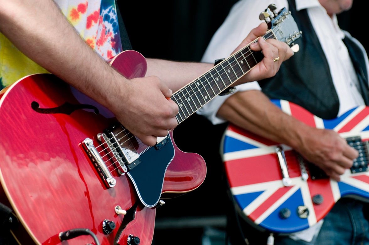 Close-up of a person playing guitars