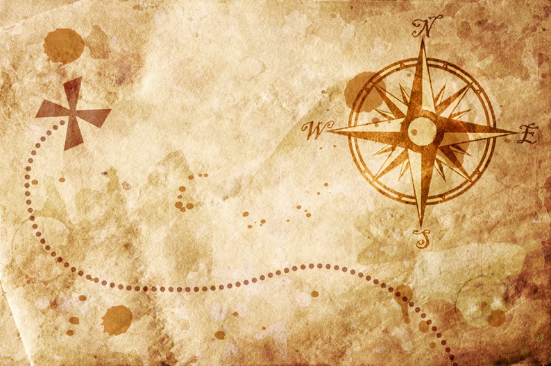 A map with a compass as part of a treasure map challenge for a sand and sea fundraiser event.

Description automatically generated