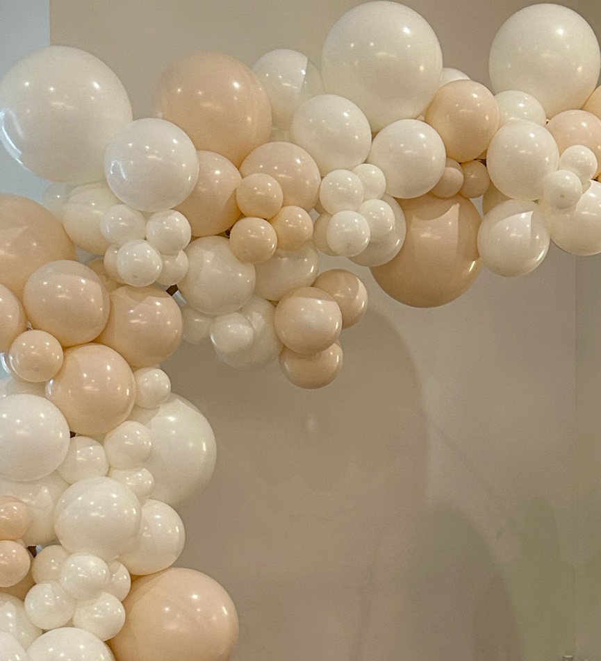 A group of balloons in a room is a great wedding theme fundraiser venue photo booth.