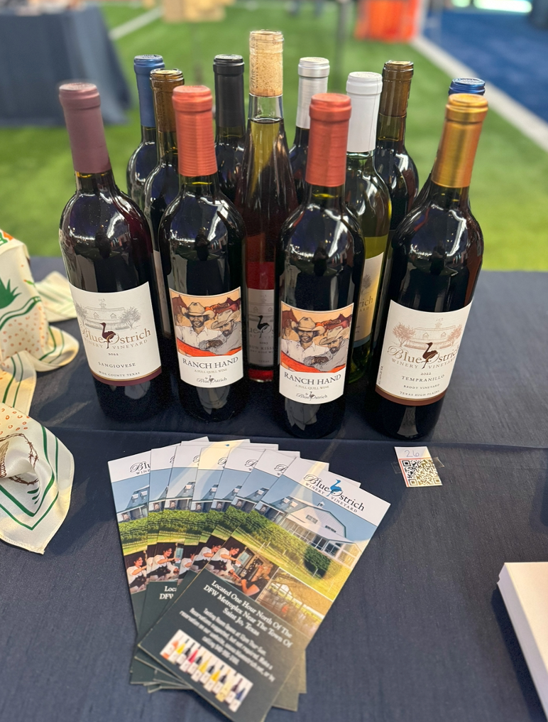 A group of wine bottles on a table make a great display for a winery auction item.