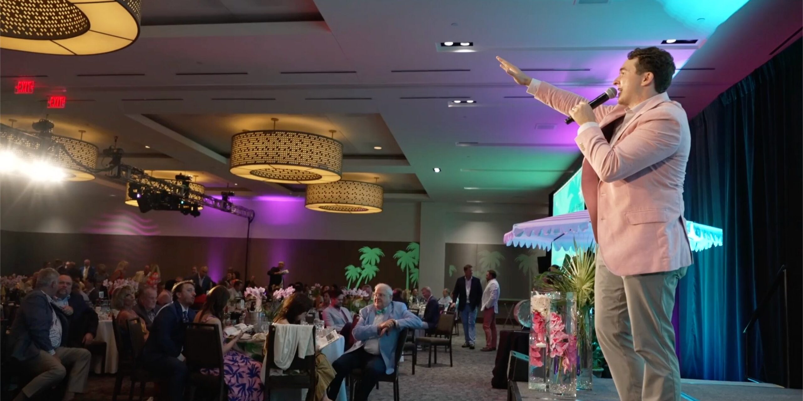 Professional auctioneer driving engagement at live fundraising event